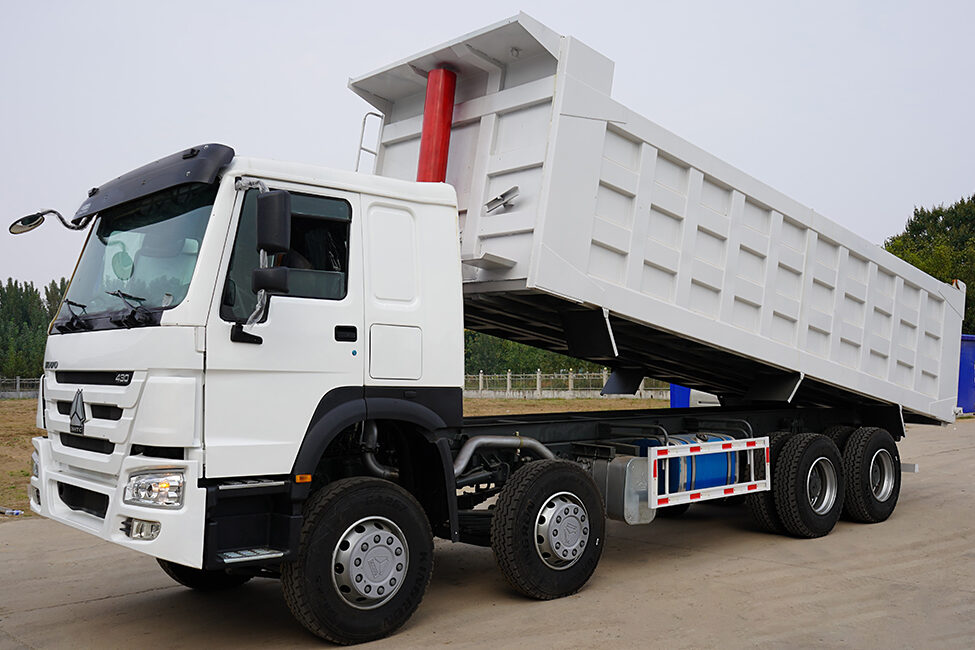 White heavy duty trucks for construction transport